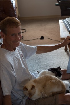 Cats are sure happy to have Dad home all the time!